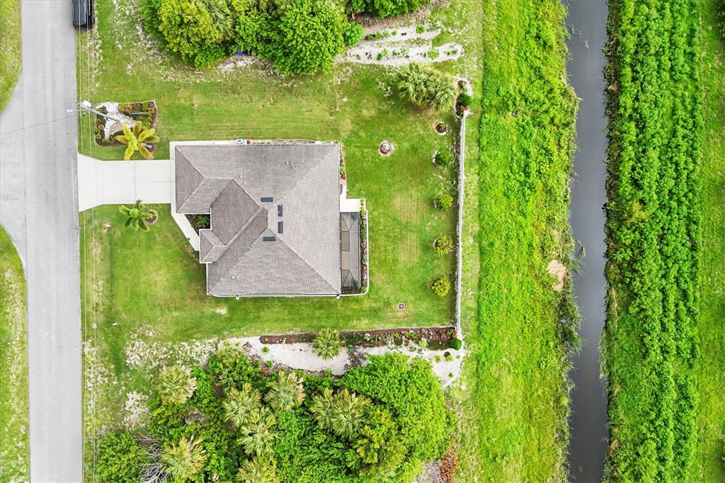 2694 Hopwood Road North Port, FL 34287 - Photo 39 of 56 an aerial view of a house with a yard
