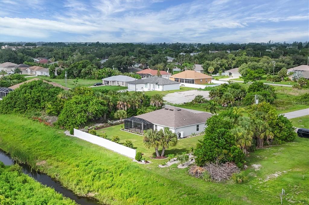 2694 Hopwood Road North Port, FL 34287 - Photo 41 of 56 an aerial view of residential houses with outdoor space and trees