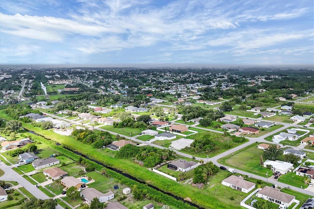 2694 Hopwood Road North Port, FL 34287 - Photo 43 of 56 an aerial view of residential houses with outdoor space