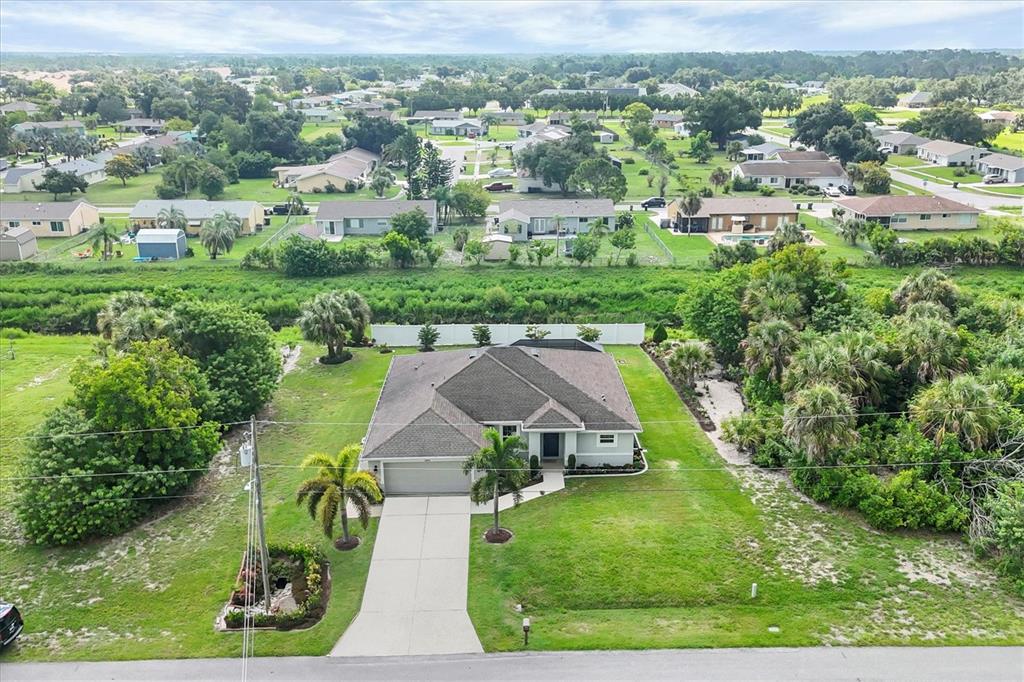 2694 Hopwood Road North Port, FL 34287 - Photo 5 of 56 an aerial view of residential houses with outdoor space and trees