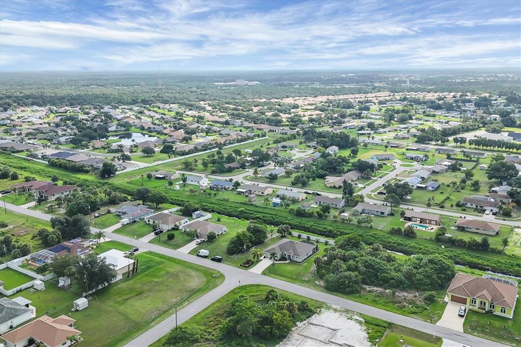 2694 Hopwood Road North Port, FL 34287 - Photo 8 of 56 an aerial view of residential houses with outdoor space and trees