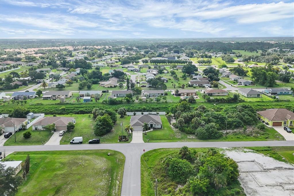 2694 Hopwood Road North Port, FL 34287 - Photo 9 of 56 an aerial view of residential houses with outdoor space and trees