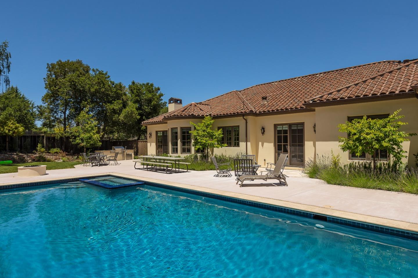 555 Barbara Way Hillsborough, CA 94010 - Photo 3 of 4 a view of a house with swimming pool and sitting area