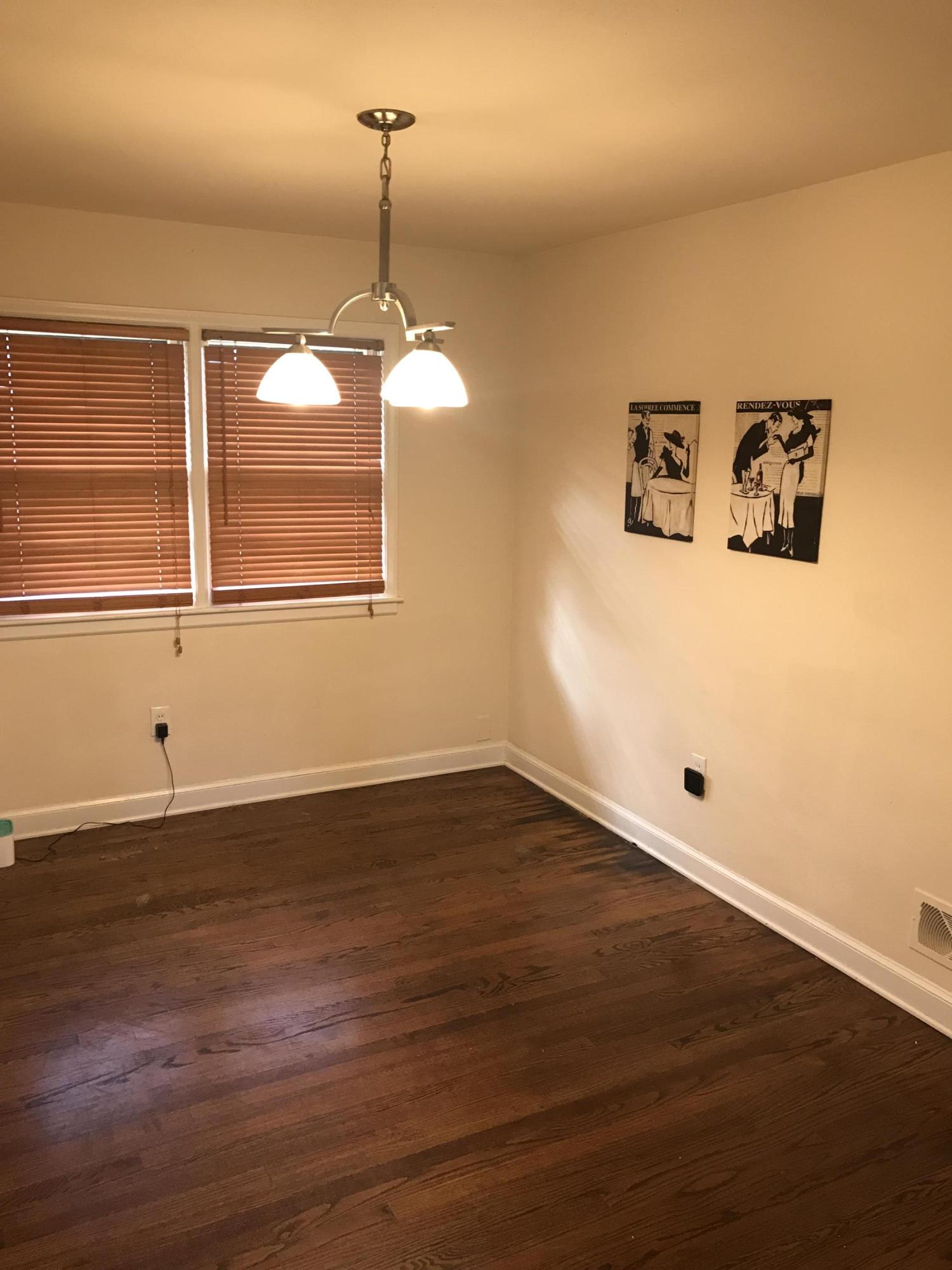 1949 Walmann Road Southwest Roanoke, VA 24018 - Photo 2 of 5 a view of a room with wooden floor and white walls