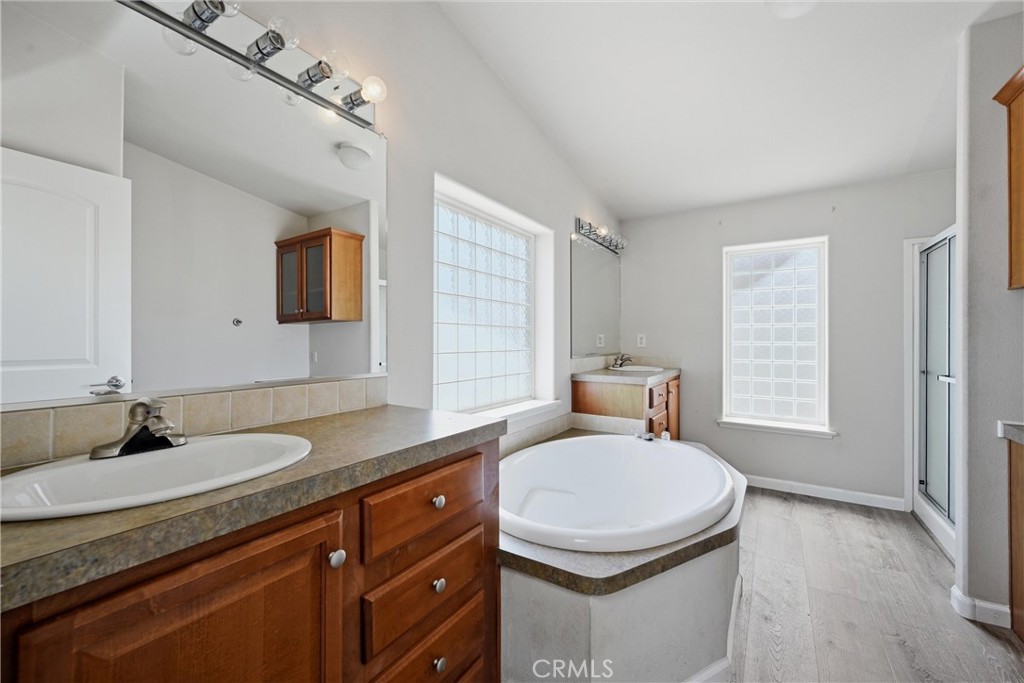 2860 Spring Valley Road Clearlake Oaks, CA 95423 - Photo 22 of 38 a bathroom with a sink double vanity and a mirror