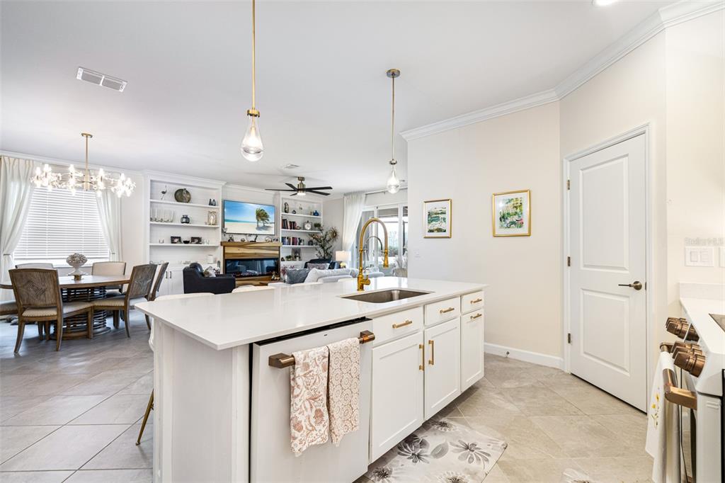 17424 Muscat Lane Punta Gorda, FL 33955 - Photo 11 of 32 a kitchen with kitchen island a sink stove and chairs