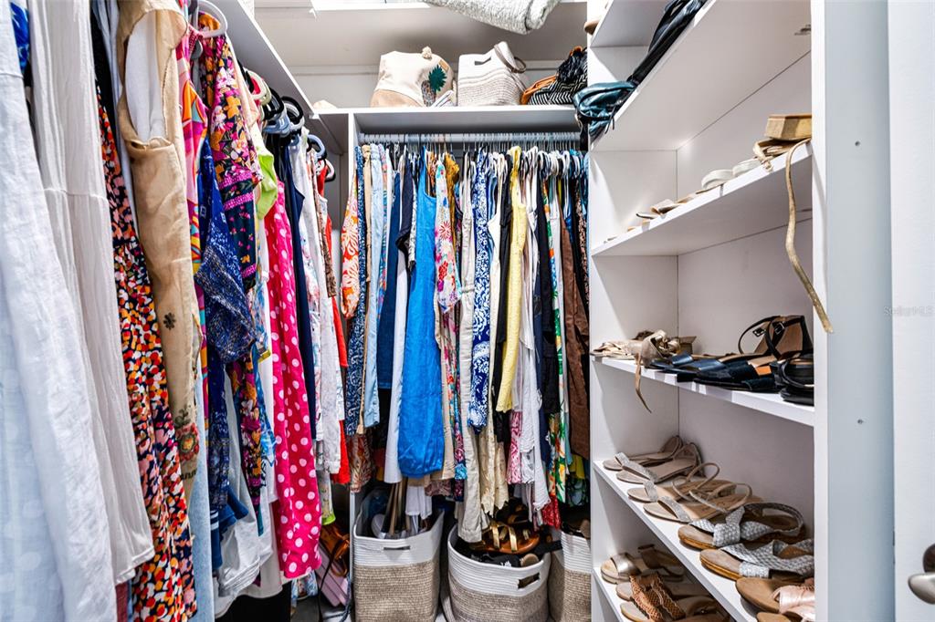 17424 Muscat Lane Punta Gorda, FL 33955 - Photo 19 of 32 a view of walk in closet with clothes and shoes