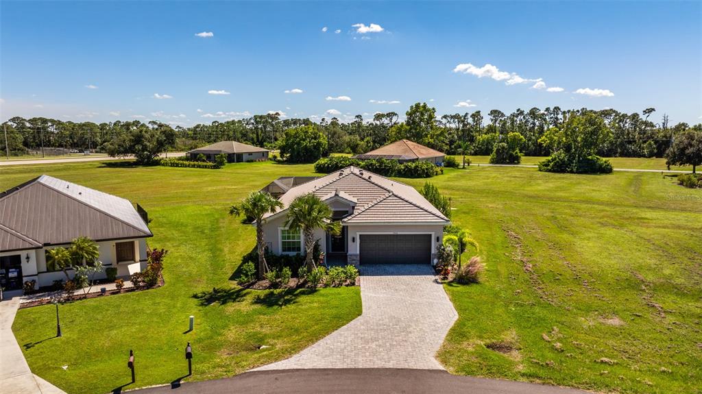17424 Muscat Lane Punta Gorda, FL 33955 - Photo 23 of 32 a aerial view of a house with swimming pool garden and outdoor seating