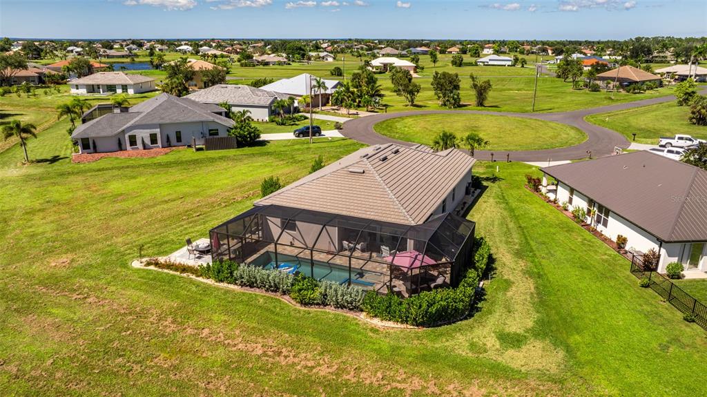 17424 Muscat Lane Punta Gorda, FL 33955 - Photo 25 of 32 an aerial view of residential houses with outdoor space and swimming pool