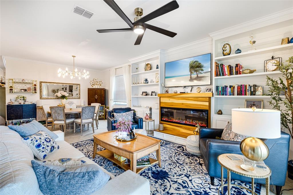 17424 Muscat Lane Punta Gorda, FL 33955 - Photo 7 of 32 a living room with furniture kitchen view and a fireplace