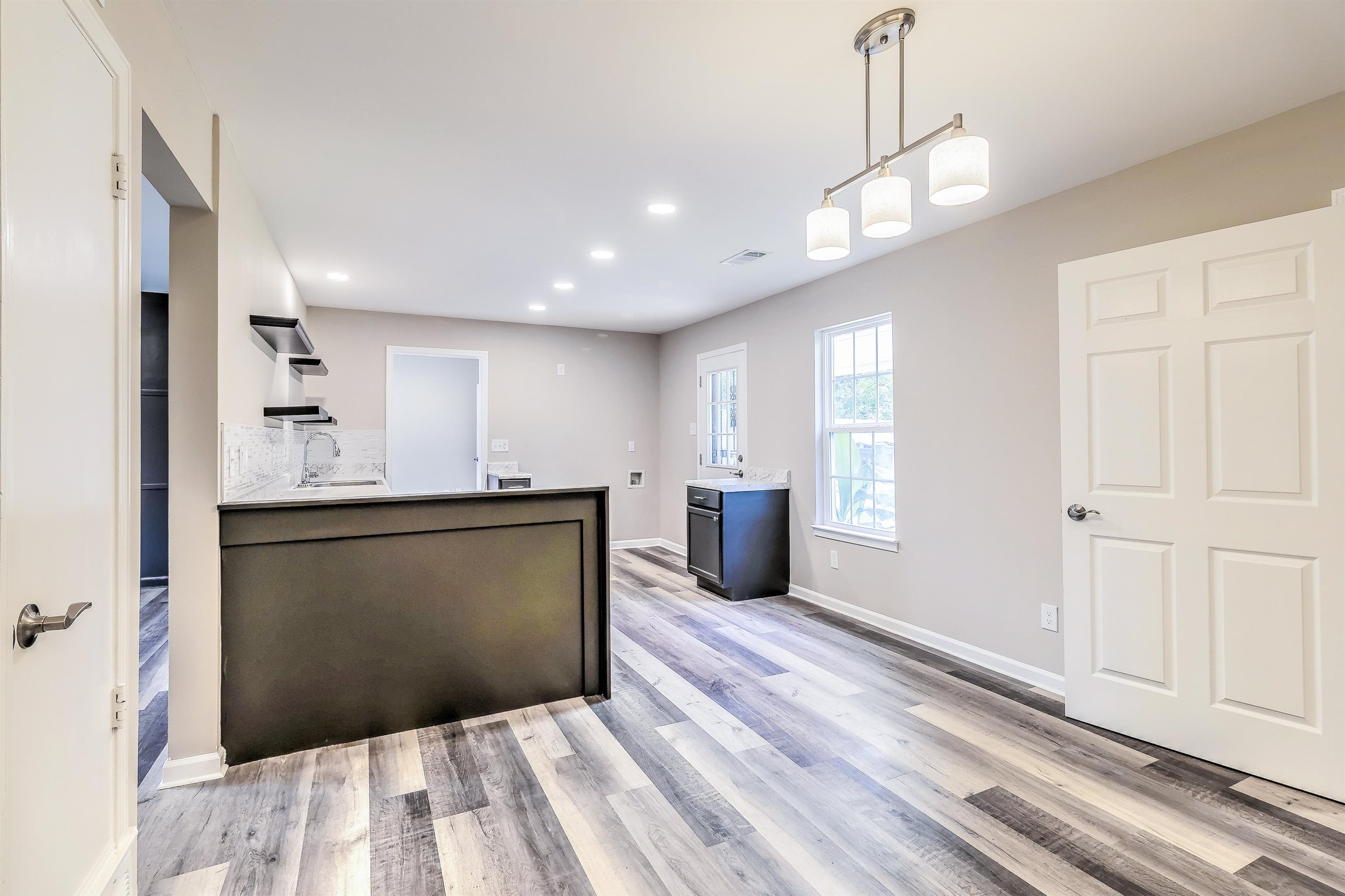 1494 Abernathy Road Memphis, TN 38116 - Photo 11 of 35 a spacious bathroom with a granite countertop sink and a mirror
