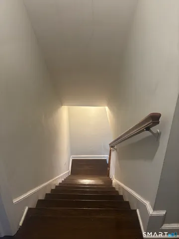 a view of a chair and table in the patio