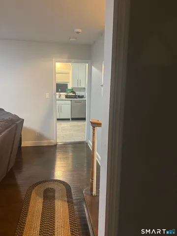 a view of a kitchen from the hallway