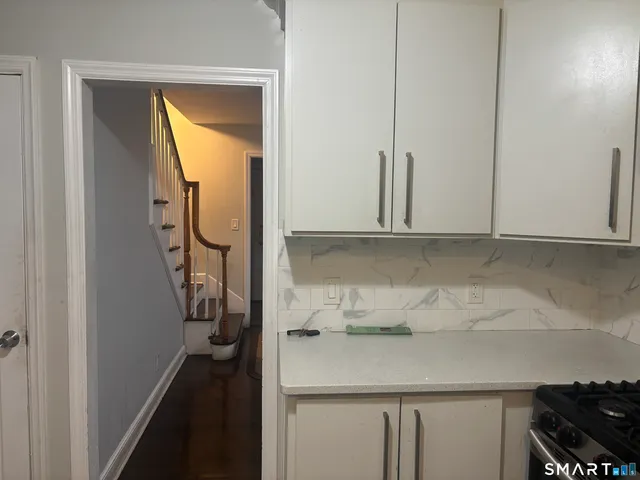 a room with a sink and cabinets