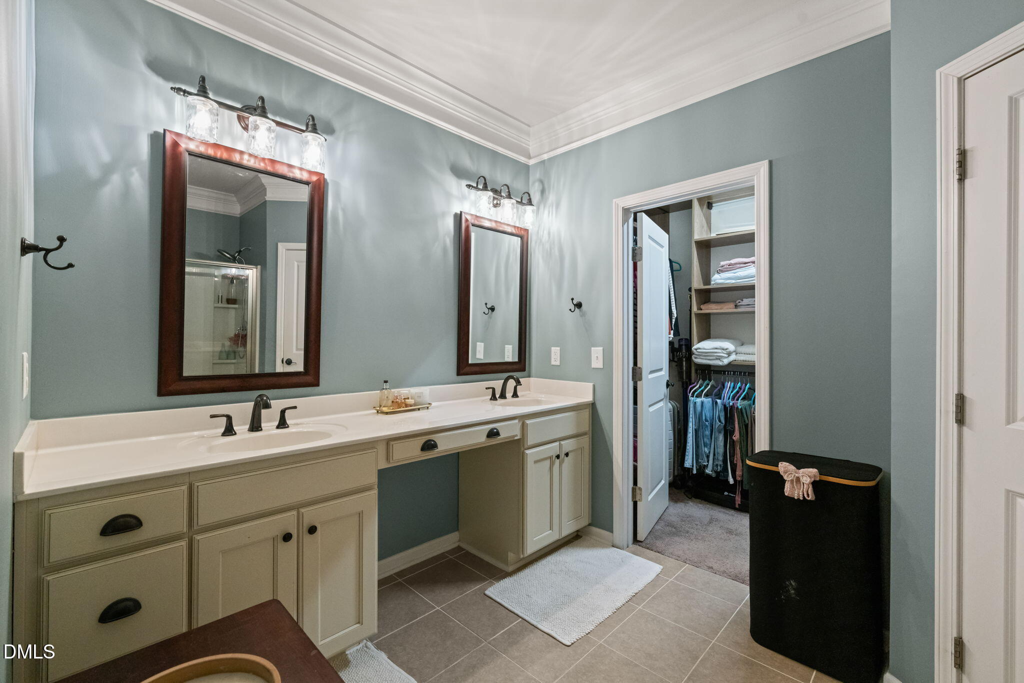 1716 Main Divide Drive Wake Forest, NC 27587 - Photo 20 of 45 a spacious bathroom with a double vanity sink and mirror