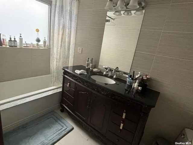 a bathroom with a double vanity sink and mirror
