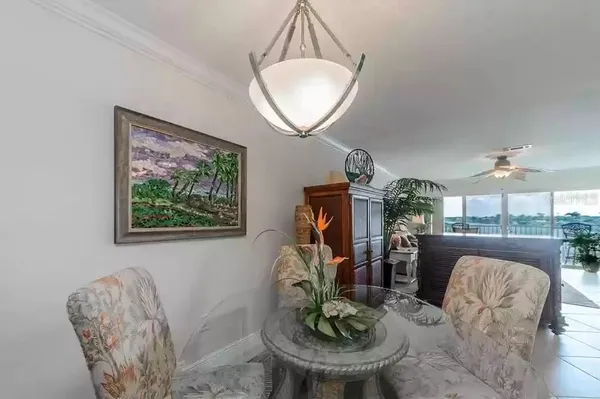 a living room with furniture and a mirror