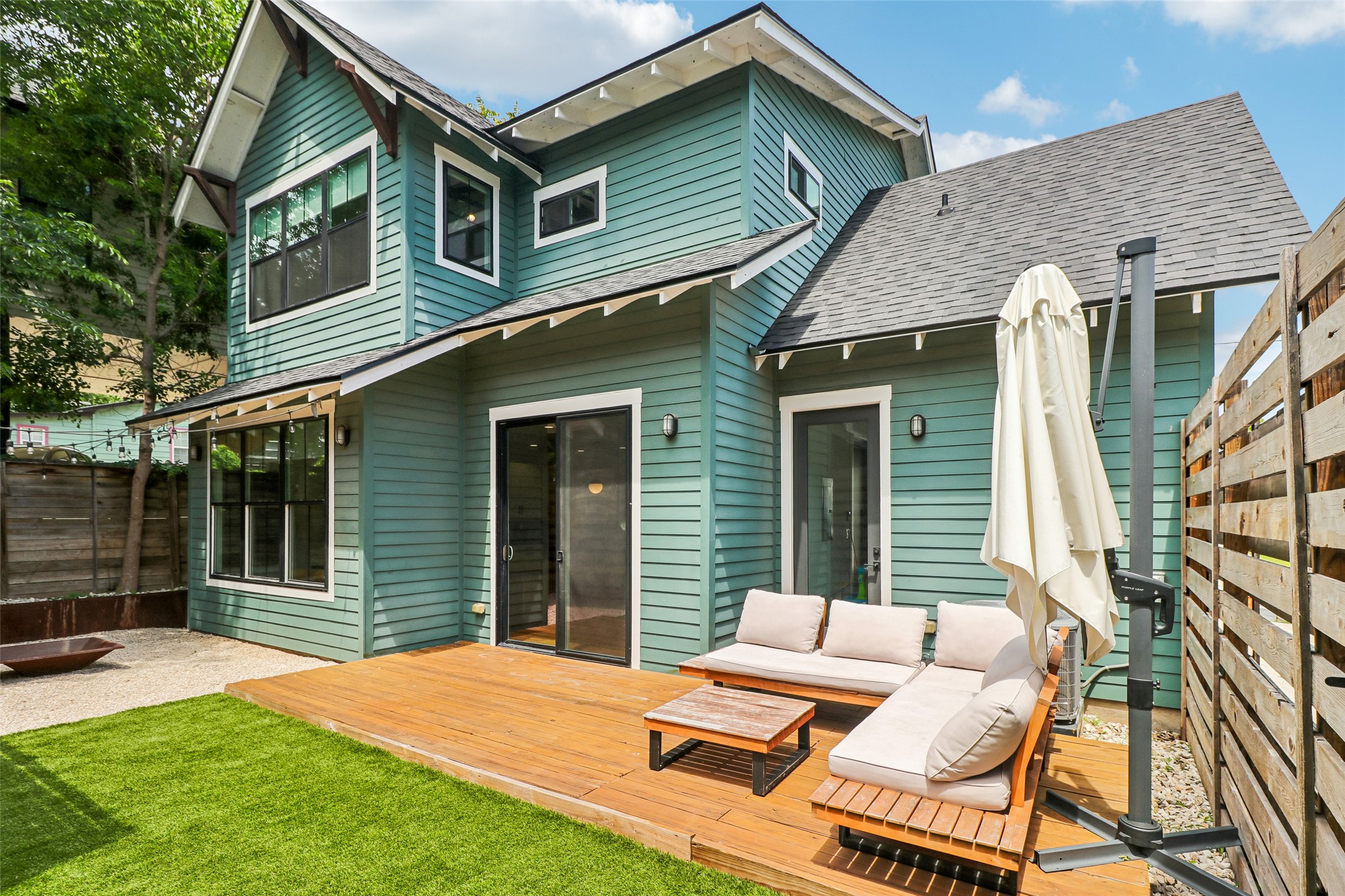 1706 Perez Street, Unit 1 Austin, TX 78721 - Photo 34 of 36 A private outdoor retreat with a spacious deck and verdant artificial turf awaits.