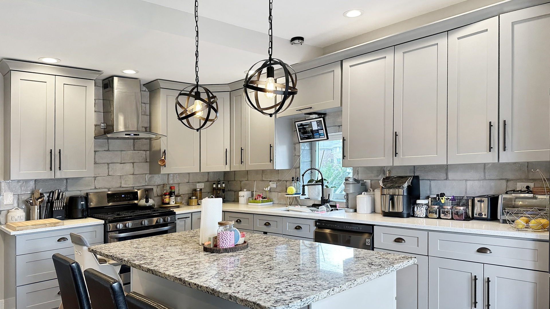 8211 43rd Place Lyons, IL 60534 - Photo 11 of 29 a kitchen with stainless steel appliances granite countertop a sink a stove and cabinets