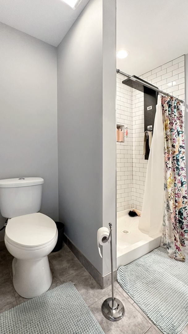 8211 43rd Place Lyons, IL 60534 - Photo 19 of 29 a bathroom with a toilet and a shower