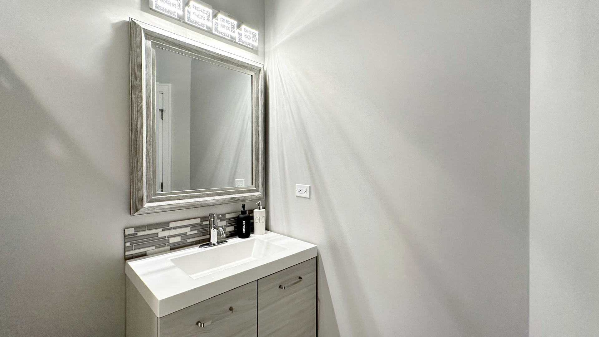 8211 43rd Place Lyons, IL 60534 - Photo 20 of 29 a bathroom with a sink and a mirror