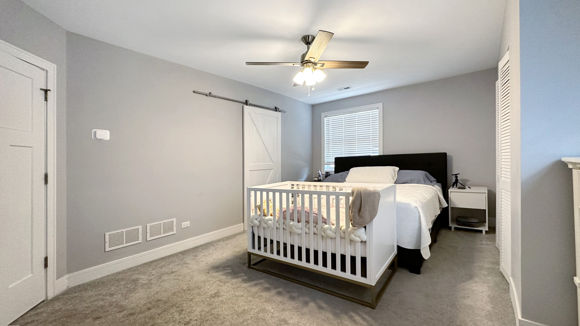 8211 43rd Place Lyons, IL 60534 - Photo 22 of 29 a bed room with a bed and a chandelier