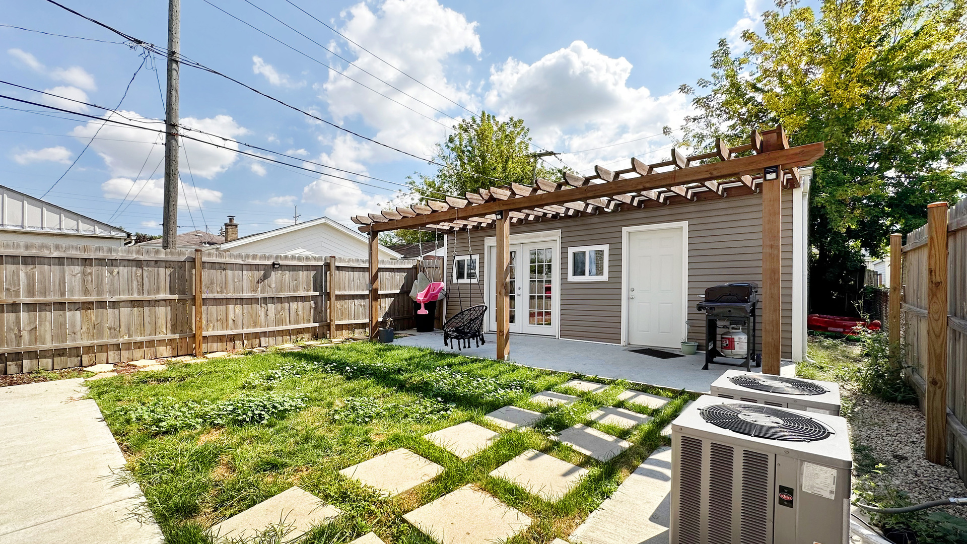 8211 43rd Place Lyons, IL 60534 - Photo 26 of 29 a view of a house with a patio and a yard