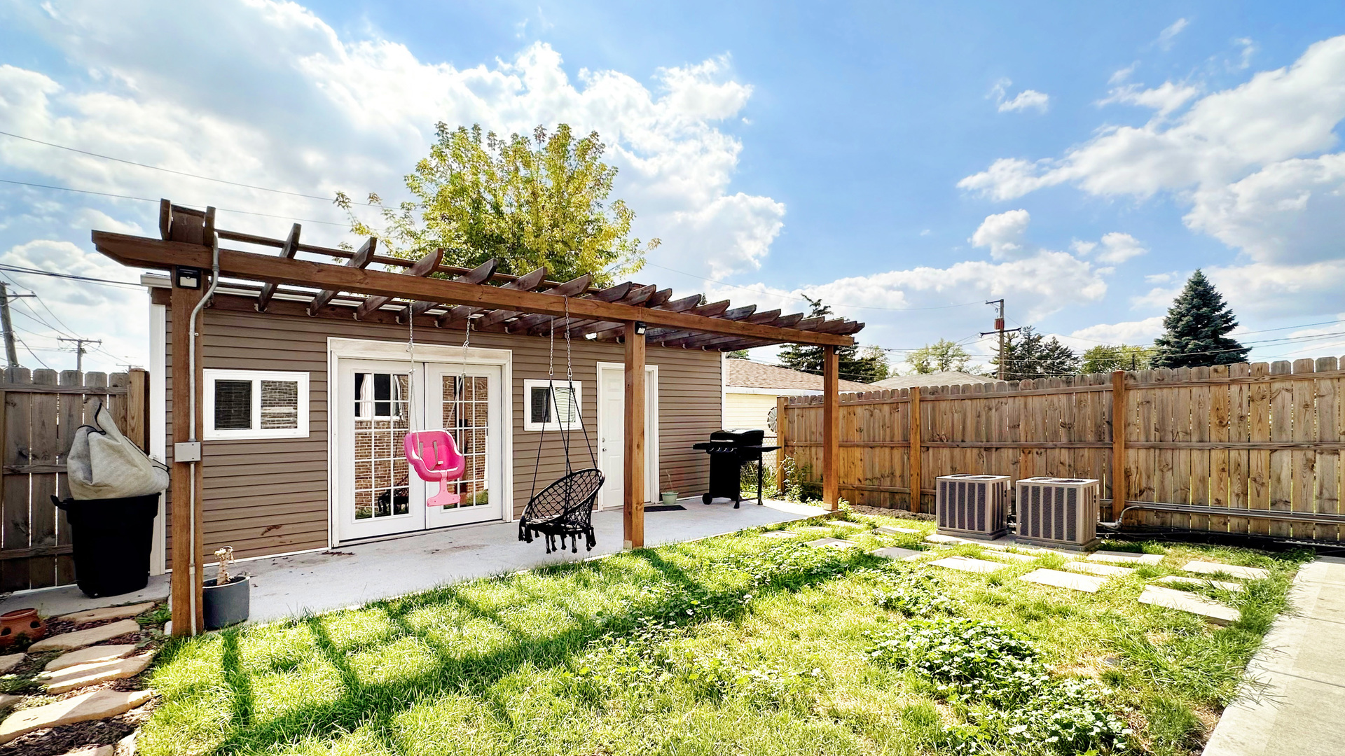 8211 43rd Place Lyons, IL 60534 - Photo 29 of 29 a view of a house with a small yard and potted plants