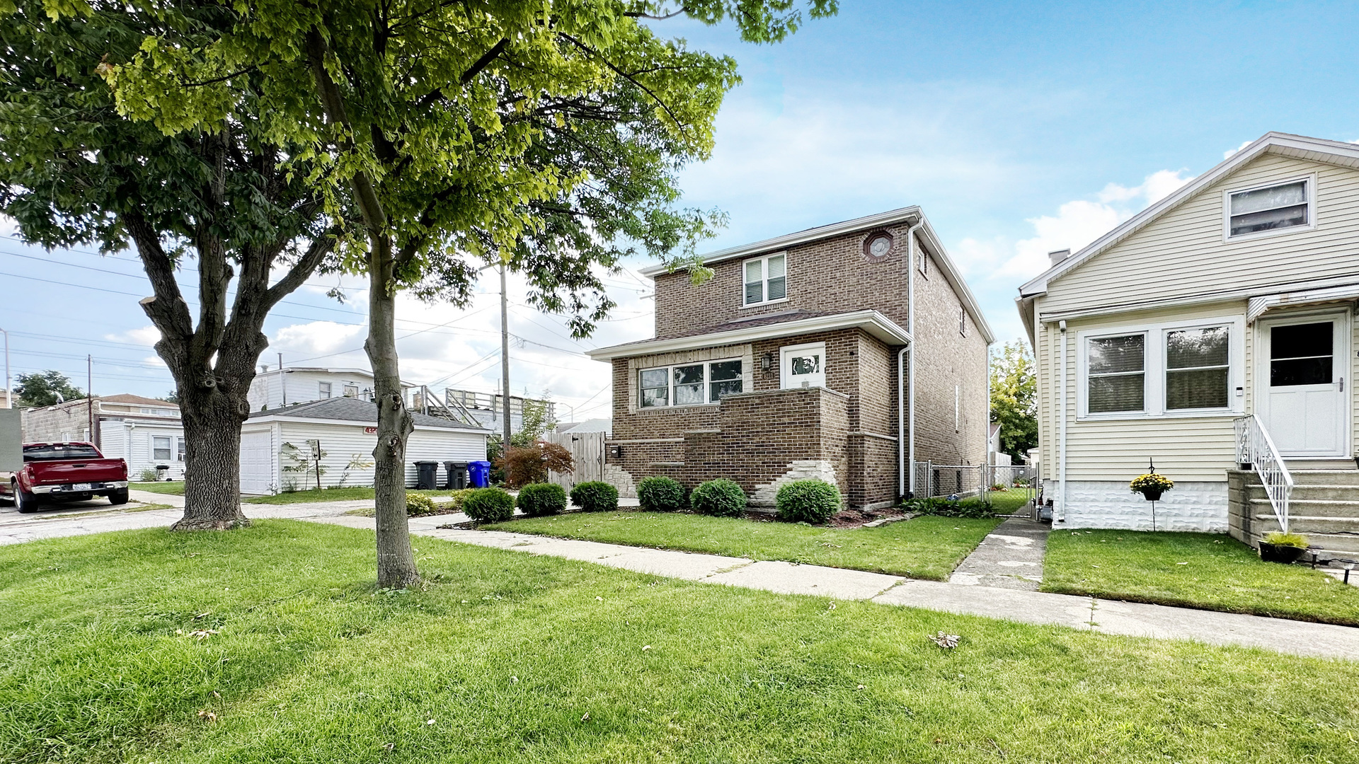 8211 43rd Place Lyons, IL 60534 - Photo 3 of 29 a front view of a house with a yard