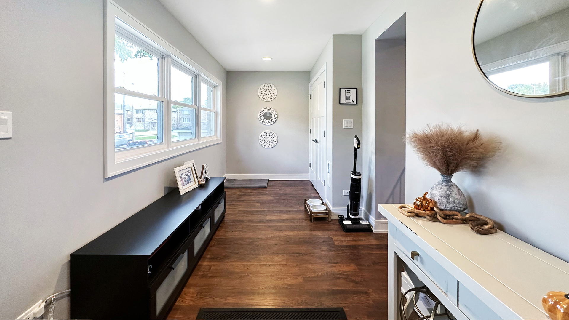 8211 43rd Place Lyons, IL 60534 - Photo 4 of 29 a room with a large window and gym equipment