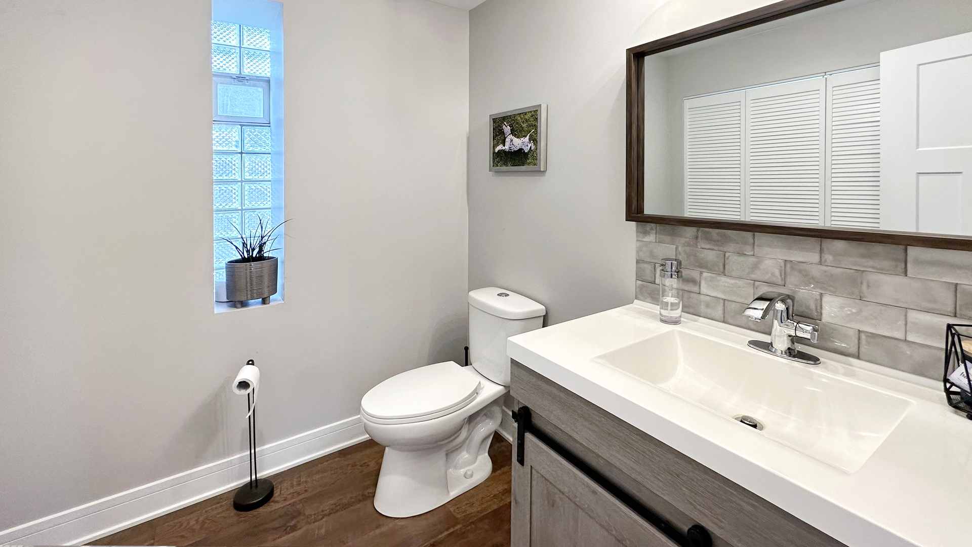 8211 43rd Place Lyons, IL 60534 - Photo 9 of 29 a bathroom with a sink toilet and vanity