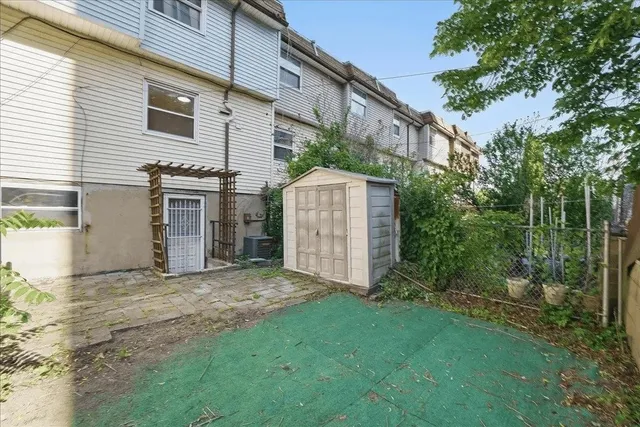 a view of a house with a yard and plants