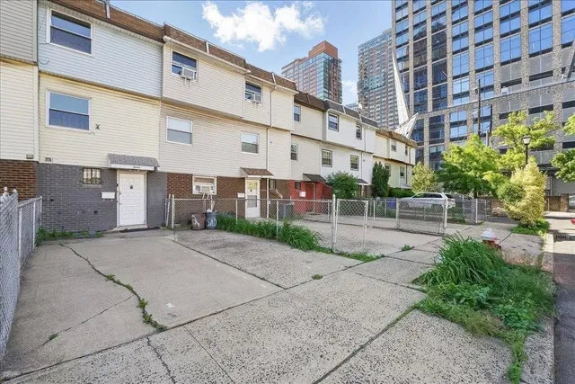 a view of a building with a yard