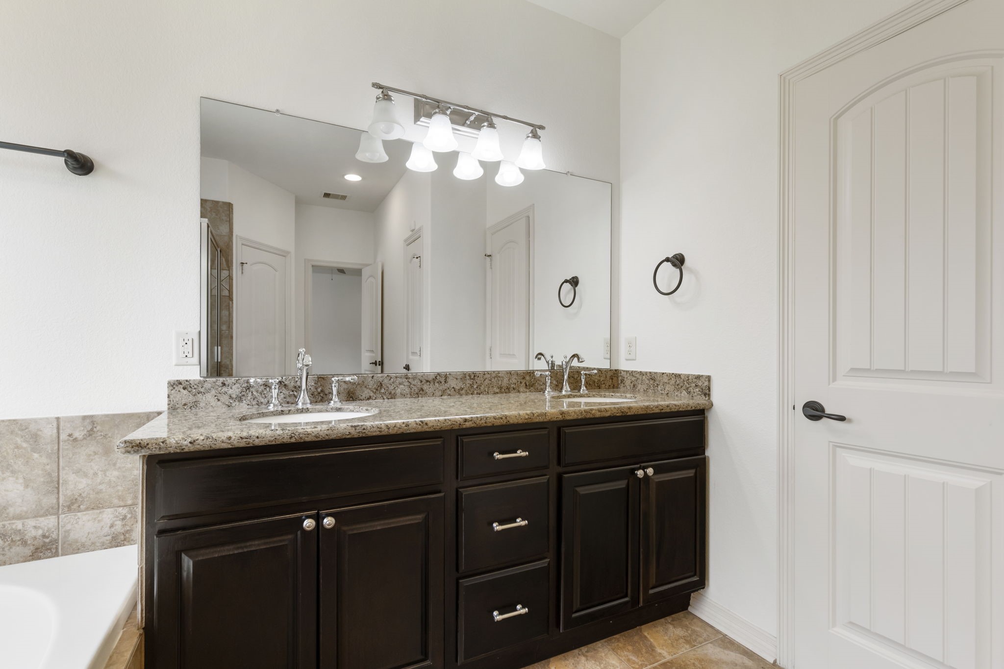 23911 Augusta Falls Lane Spring, TX 77389 - Photo 20 of 40 a bathroom with double sink and mirror