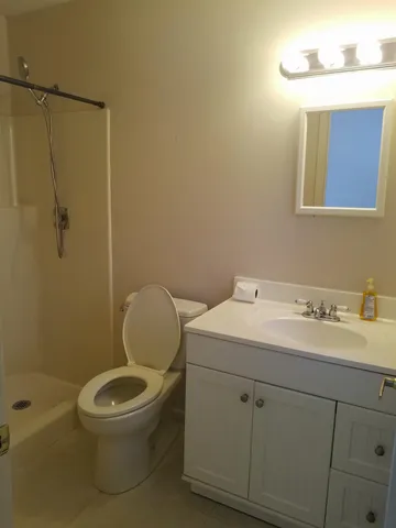 a view of an empty room with a window