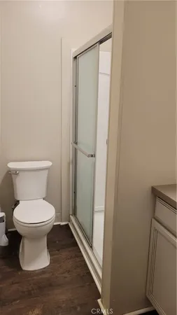a white toilet sitting in a bathroom