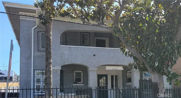 a front view of a house with yard