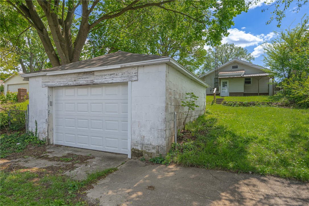 2118 Hillside Avenue Springfield, OH 45503 - Photo 21 of 28 This property features a separate garage building with an adjacent grassy yard leading to the main house.