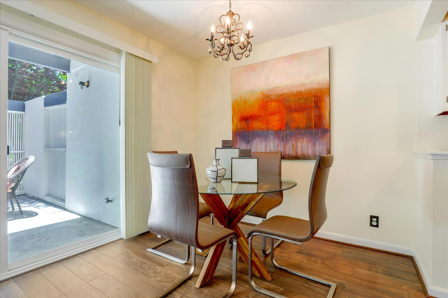1033 Shell Boulevard, Unit 3 Foster City, CA 94404 - Photo 12 of 33 a view of a dining room with furniture and wooden floor