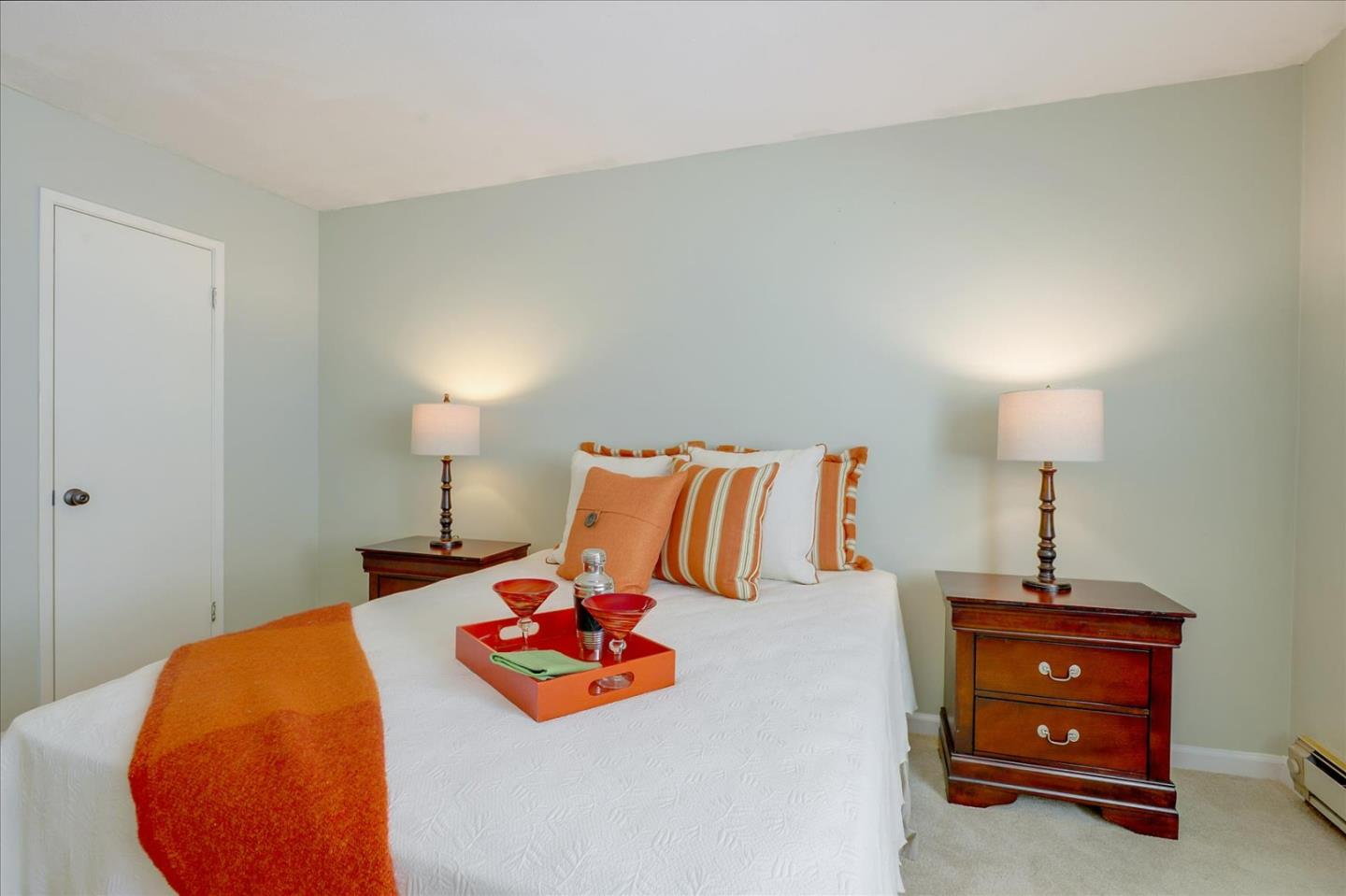 1033 Shell Boulevard, Unit 3 Foster City, CA 94404 - Photo 20 of 33 a bedroom with a bed and a lamp on the dresser