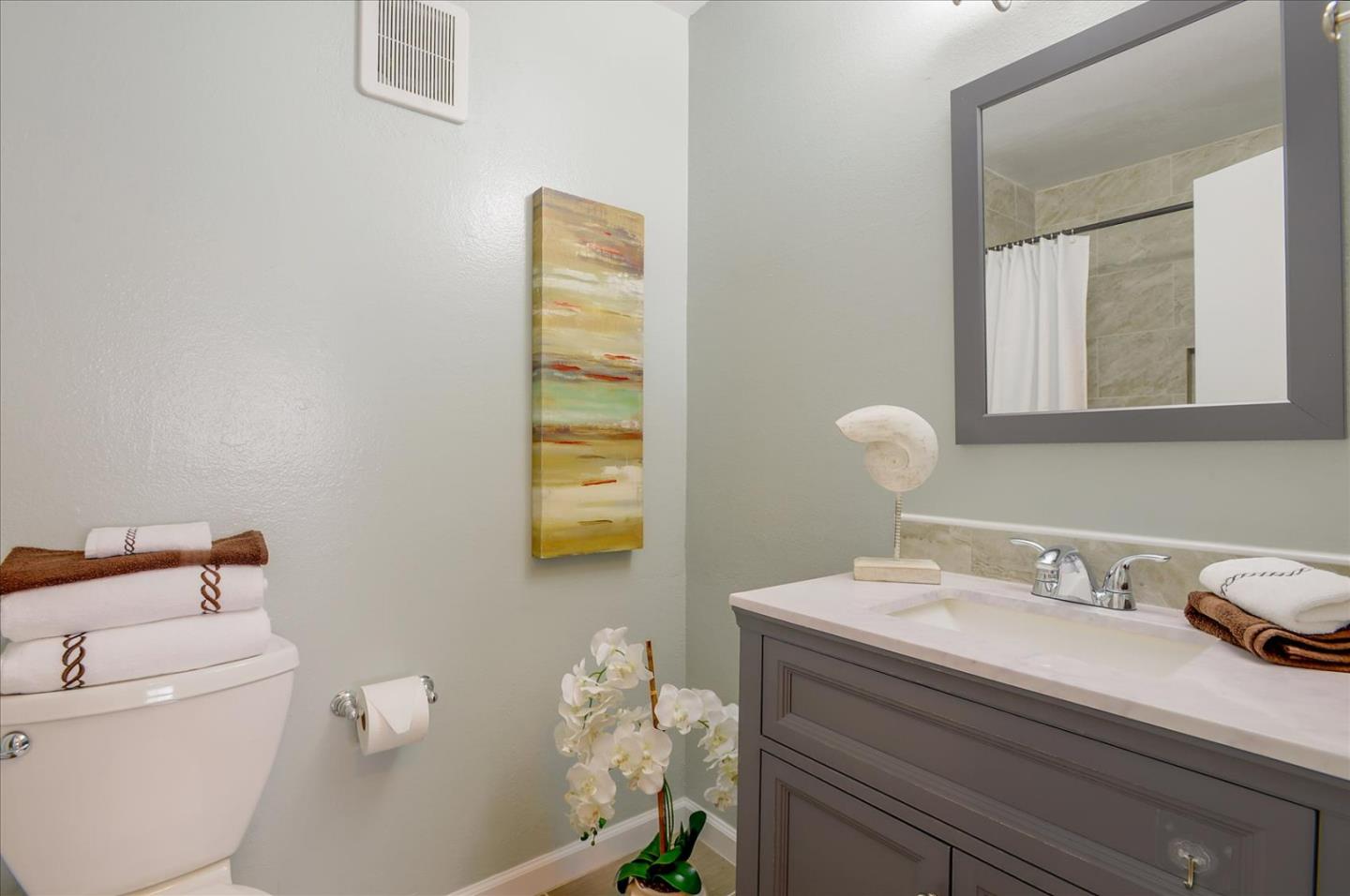 1033 Shell Boulevard, Unit 3 Foster City, CA 94404 - Photo 23 of 33 a bathroom with a sink toilet and a mirror