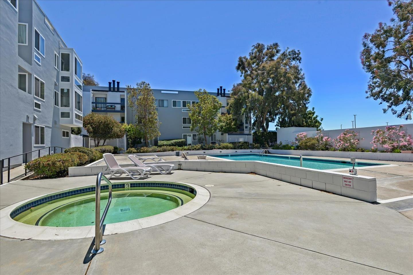 1033 Shell Boulevard, Unit 3 Foster City, CA 94404 - Photo 27 of 33 a swimming pool with outdoor seating and yard