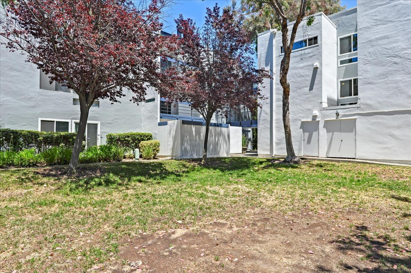 1033 Shell Boulevard, Unit 3 Foster City, CA 94404 - Photo 30 of 33 a backyard of a house with lots of green space
