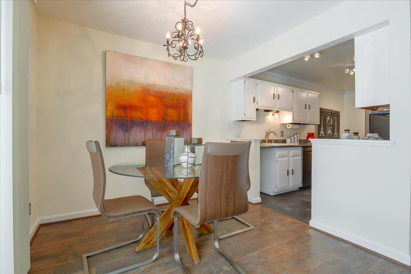 1033 Shell Boulevard, Unit 3 Foster City, CA 94404 - Photo 5 of 33 a view of a dining room with furniture and a chandelier