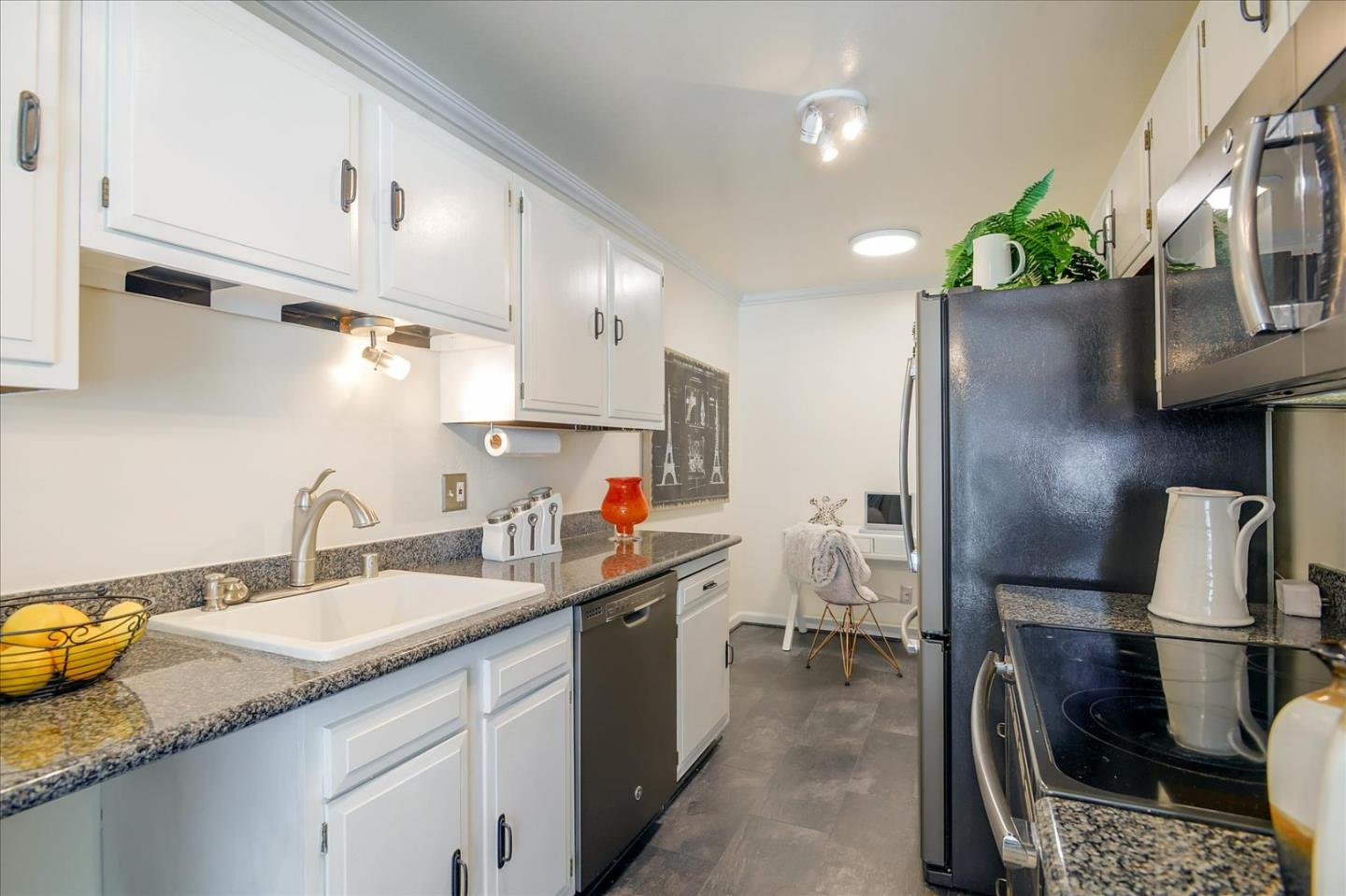 1033 Shell Boulevard, Unit 3 Foster City, CA 94404 - Photo 6 of 33 a kitchen with sink refrigerator and microwave