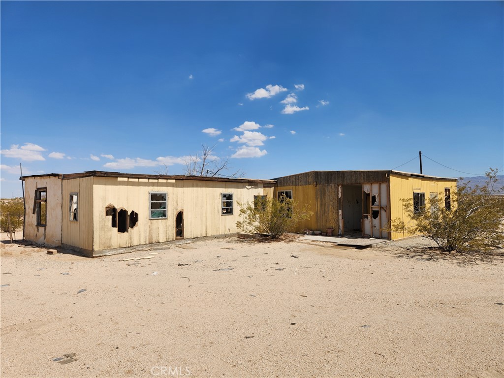 29 Mac Rae Road Twentynine Palms, CA 92277 - Photo 1 of 1 a view of a house with a snow in the yard
