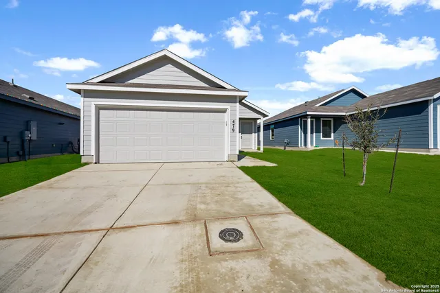 a front view of a house with yard