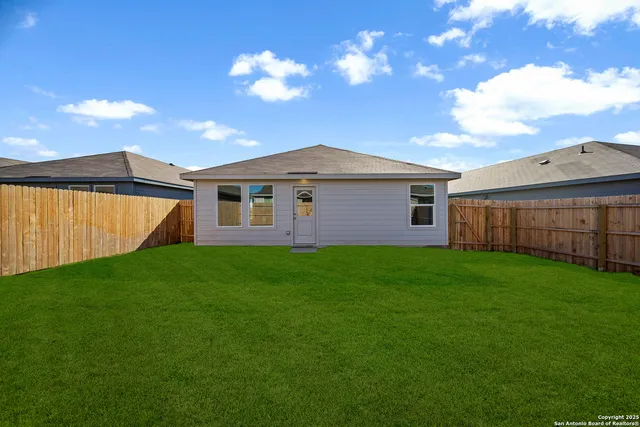 a view of a yard with a house