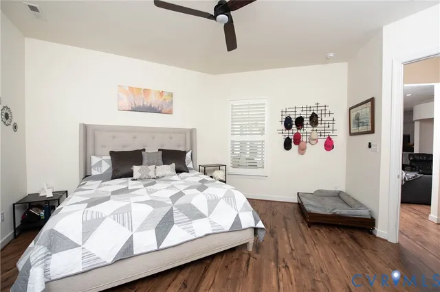 a bedroom with a bed and a couch