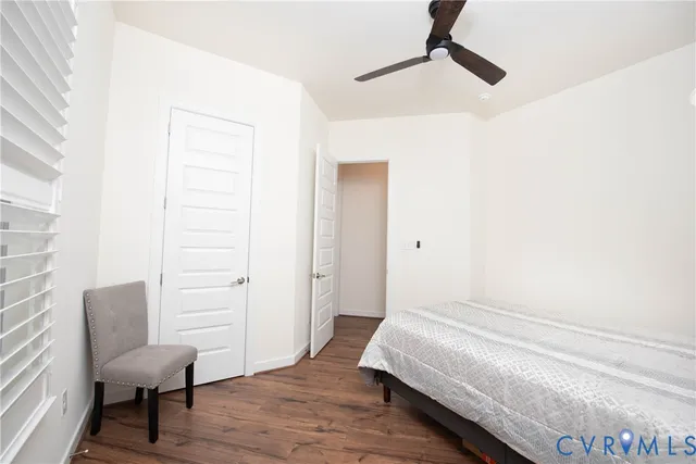 a bedroom with a bed and a chair